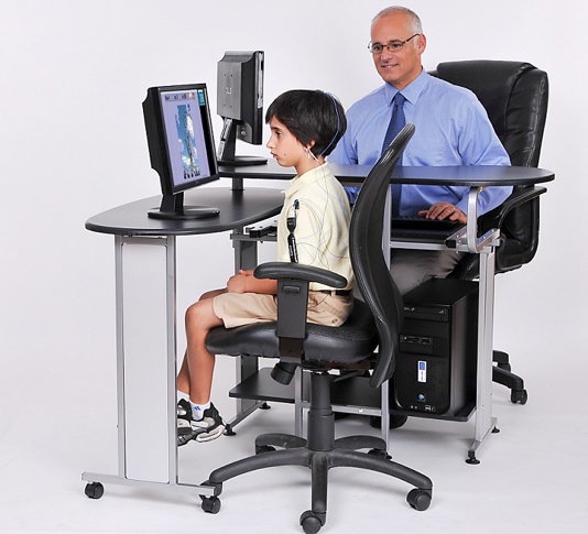 Child looking at a screen with an adult sitting alongside